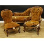 A Victorian walnut drawing room suite, comprising a chaise longue, an armchair and side chair,