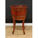A substantial Edwardian coopered mahogany flower trough, of country house proportions, outwept legs,