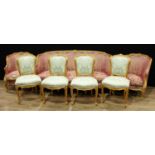 A Louis XV style giltwood seven piece drawing room suite, comprising a sofa, a pair of armchairs and