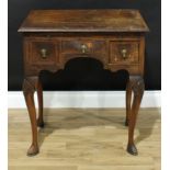 A Queen Anne design walnut lowboy, crossbanded rectangular top with matched veneers above a slide