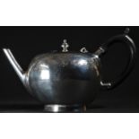 An early George II silver bullet shaped teapot, flat-chased with a shoulder of acanthus scrolls,
