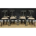 A set of eight Anglo-Indian/Ceylonese ebony dining chairs, pierced and carved with stylised