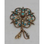An Edwardian 9ct yellow gold star pendant, set with turquoise and seed pearls, 4cm over loop,