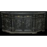 A 19th century oak canted rectangular buffet side cabinet, slightly oversailing top above an