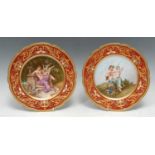 A fine pair of Vienna porcelain shaped circular cabinet plates, signed by Deluc, each decorated to