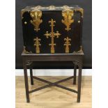 A 19th century South European ebonised cabinet on stand, fall front enclosing an arrangement of