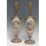 A pair of Bohemian glass pedestal oval vases, decorated with oval panels of colourful summer
