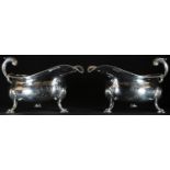 A pair of large George III silver sauce boats, of substantial gauge, acanthus-capped flying-scroll