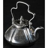 An 18th century Dutch silver toy kettle, shaped handle, 6cm long, c.1770