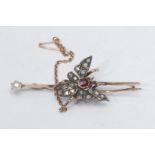 A Victorian diamond and ruby butterfly bar brooch, central oval deep red ruby approx 0.10ct,