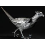 A Continental silver coloured metal novelty table decoration, cast as a game bird, 24.5cm long