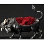 An Austrian cold painted bronze novelty pin cushion or pen wipe, cast as a bull, he stands, head