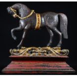 A polychrome painted and parcel-gilt cast iron door stop, as a prancing horse, 28cm high, 27cm wide