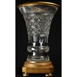 A 19th century ormolu mounted hobnail-cut clear glass trumpet shaped table centre vase, engine-