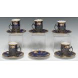 A set of five Edwardian silver-mounted Coalport porcelain cabinet coffee cups and stands, painted