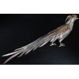 A Spanish silver and parcel-gilt table decoration, as a pheasant, 38cm long, 9.75oz