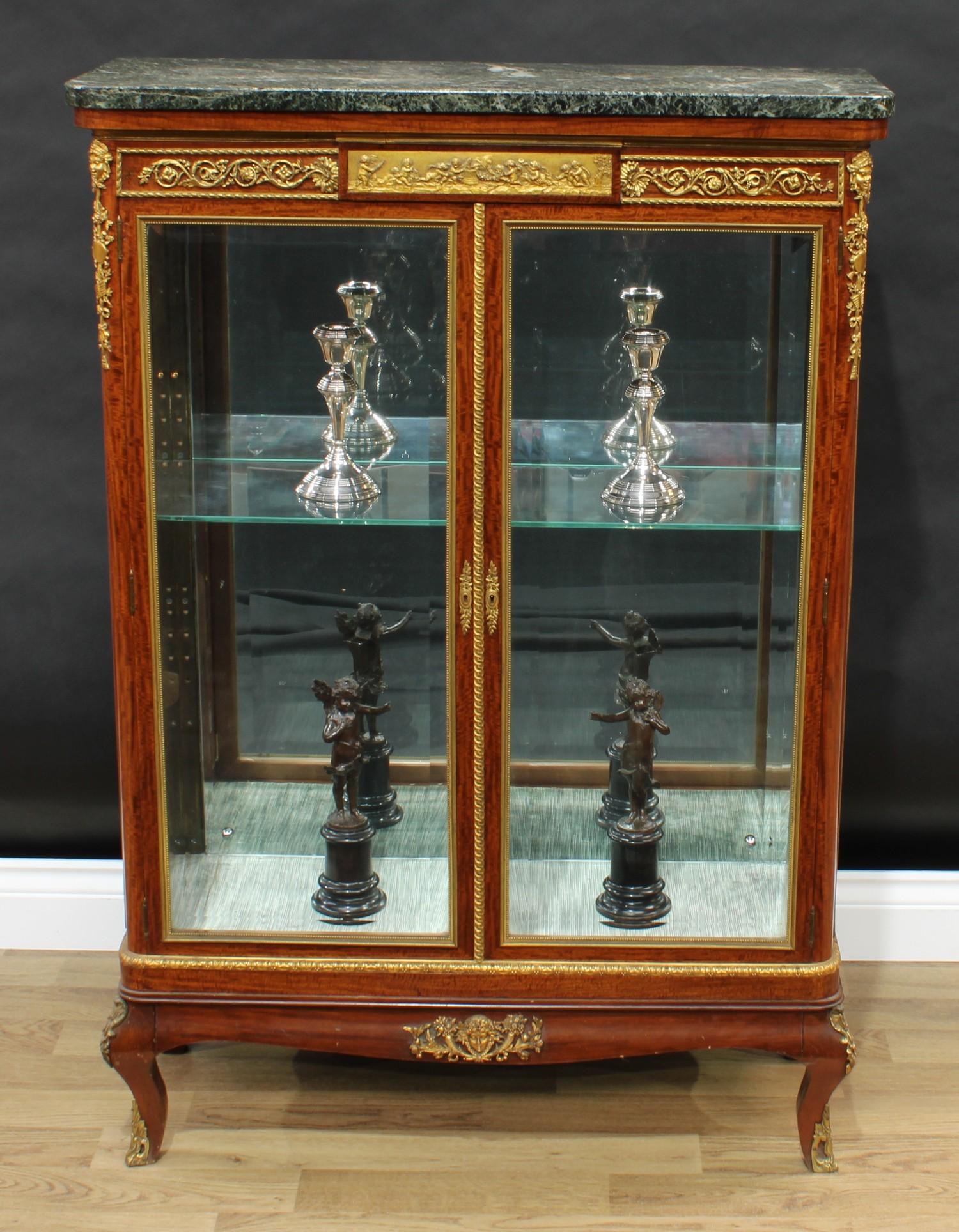A Louis XVI Revival gilt metal mounted satinwood vitrine, marble top above a deep frieze centred
