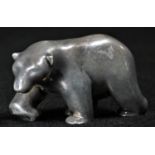 An Elizabeth II cast silver model, of a polar bear, 5.5cm long, London 2003