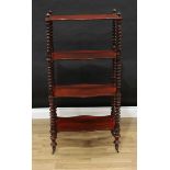 A Victorian mahogany serpentine four-tier whatnot, bobbin-turned supports, brass casters, 121cm