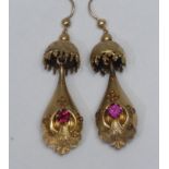 A pair of gilt metal and pink stone bomb drop earrings, umbrella top suspending a hollow cast