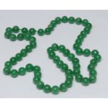 A green stone jade effect globular bead single strand necklace, bead diameter approx 12mm, 82cm long