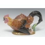 A George Jones Majolica novelty teapot and cover, modelled as a cockerel in defensive pose, his beak