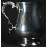 A George III style silver bell shaped mug, quite plain, acanthus capped double-scroll handle,