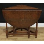 An 18th century oak credence table, rounded fall leaf, turned legs, 75cm high, 86cm wide, c.1750