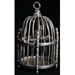 A Dutch silver toy, as a miniature bird in a cage, 5.5cm high, marked to base, 19th/early 20th