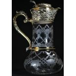 A Victorian silver-gilt mounted claret jug, chased and etched with strapwork and fruiting vine,