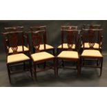 A set of eight Chippendale Revival mahogany dining chairs, comprising six side chairs and a pair