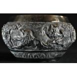 An Indian silver circular bowl, chased in high relief with a hunting scene, 11cm diam, c.1900, 4.