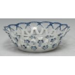 A Worcester Pine Cone pattern shaped circular basket, printed in underglaze blue with peony