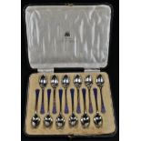 A set of twelve George V silver and enamel teaspoons, Levi & Salaman, Birmingham 1920, cased