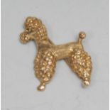 A 9ct gold novelty canine brooch, as a standard poodle, 2.5cm long, London 1963, 6g