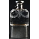 An Edwardian silver, tortoiseshell and pique mounted hip flask, hinged bayonet cover inlaid in the