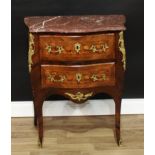 A Louis XV Revival gilt metal mounted kingwood, rosewood and marquetry bombe shaped commode, of