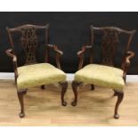 A pair of Chippendale design mahogany armchairs, shaped cresting rails and pierced interlaced