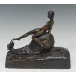 E.Worner, German, early 20th century, a brown patinated bronze, of a naked female riding an oversize
