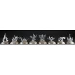 A set of eight Siamese silver novelty menu holders, in the form of ships, animals and deities, domed