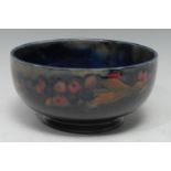 A Moorcroft Pomegranate pattern bowl tube lined with sliced and whole fruit, 16cm diam, impressed