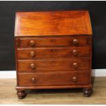 An early Victorian provincial mahogany bureau, fall front enclosing a fitted interior, above four