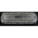 A George IV silver rounded rectangular snuff box, engine turned, hinged cover with applied foliate