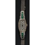 An Art Deco platinum diamond and emerald cocktail watch, 23.7g gross