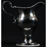A George III silver baluster cream jug, quite plain, acanthus-capped scroll handle, gadrooned