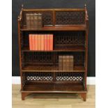 A Chippendale Revival style open bookcase, pierced throughout with Gothic tracery, bracket feet,