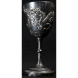 A Chinese silver miniature goblet, applied with a dragon chasing a flaming pearl, 9cm high,