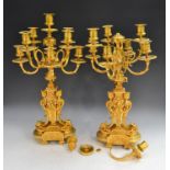 A pair of Louis XVI Revival gilt-metal nine-light table candelabrum, campana sconces, circular