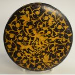 A 19th century Renaissance Revival black papier-mâché circular table-top snuff box, painted in