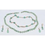 A 15ct gold and jade green globular bead necklace and earring suite, the necklace composed of twelve